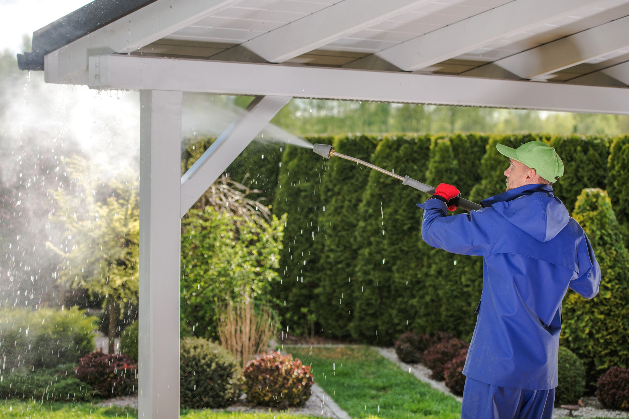 Men Pressure Washing Garden Porch Roof